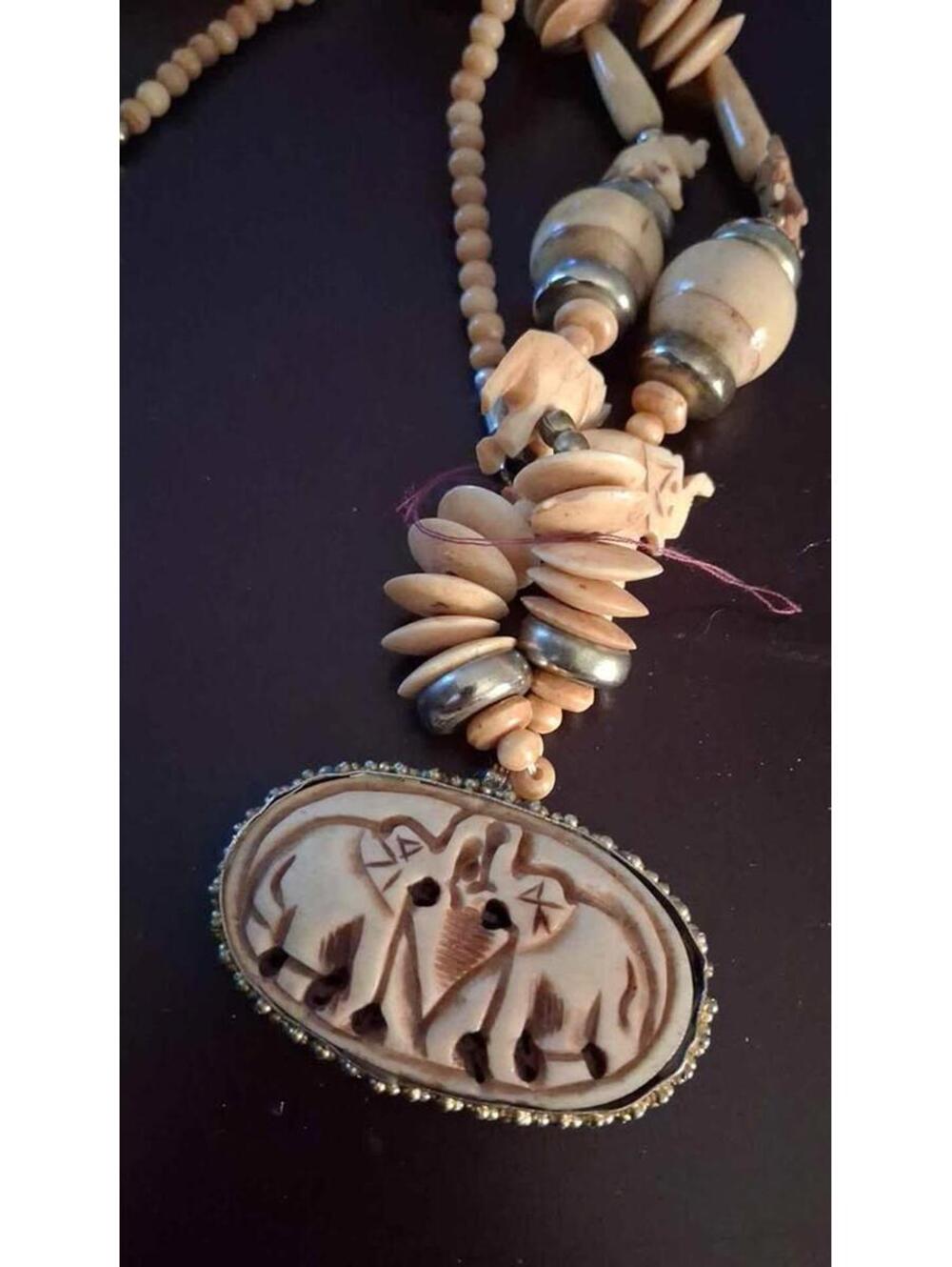 1980s carved bone and brass spacer figural elephant pendant ethnic tribal